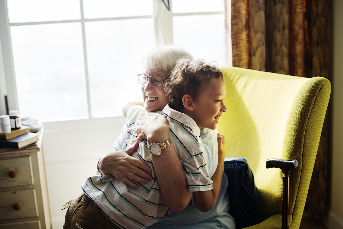 Grandma and grandson hugging together